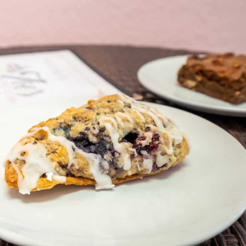 Iced berry scone on a plate